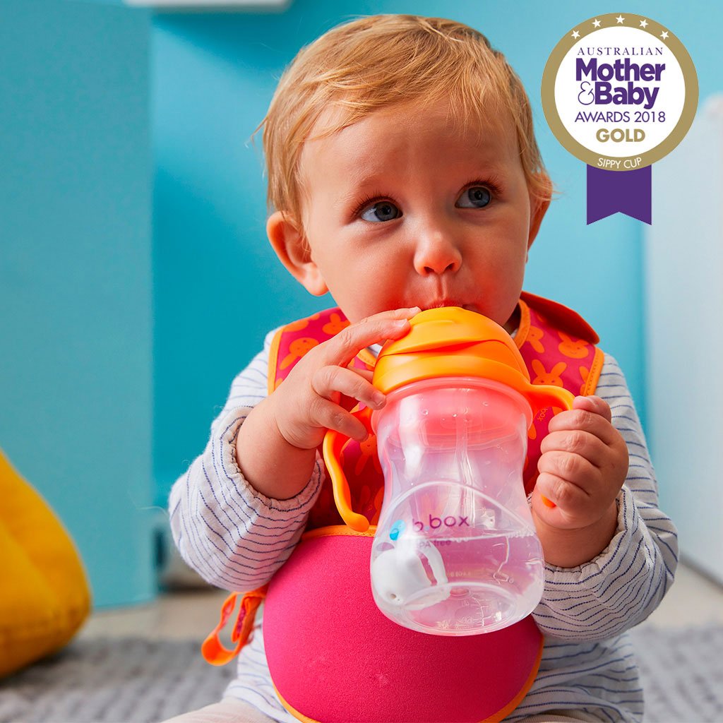 child with sippy cup - orange zing - b.box for kids